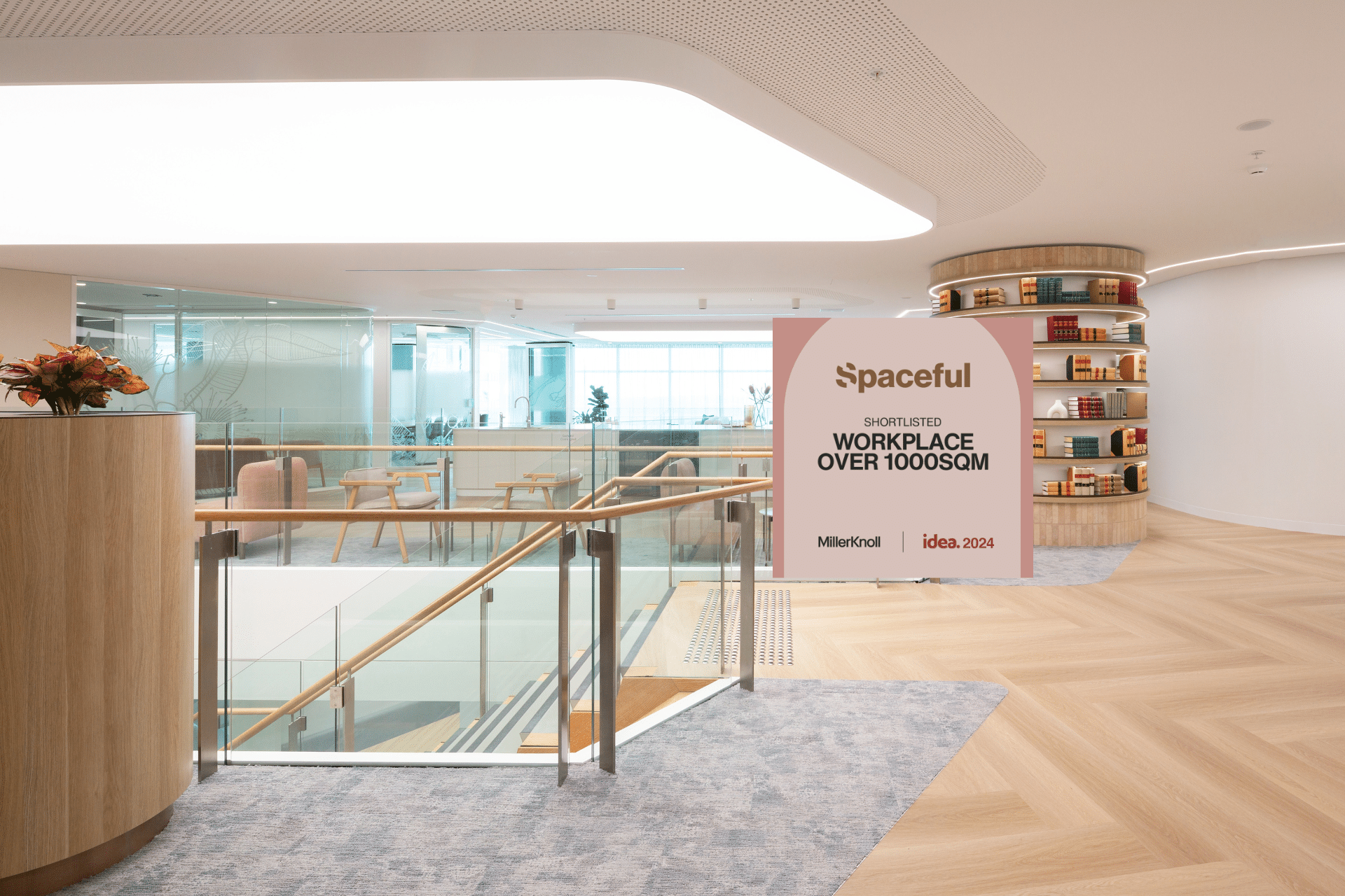 Contemporary two level office space with modern furnishings and stairs leading to the second level.