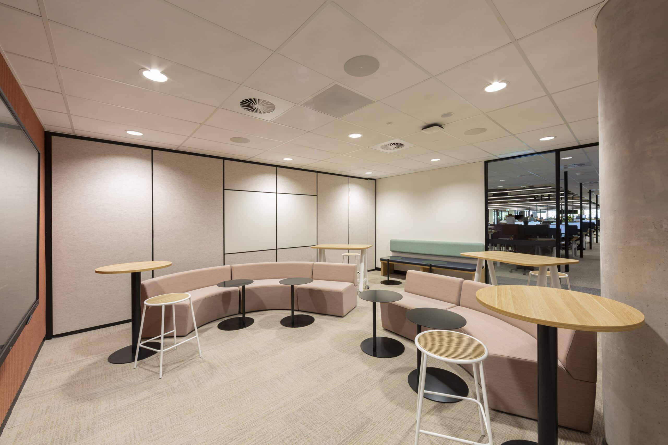 A contemporary break out space with various options for seating, and a stylish, open design for a welcoming atmosphere.