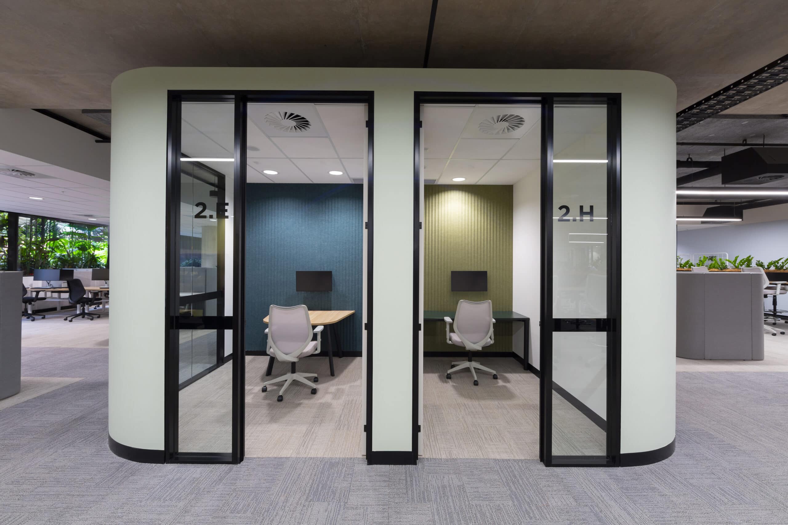 Elegant quiet rooms with a minimalist design, comfortable seating, and soft lighting, providing a private space for focused work or meetings.