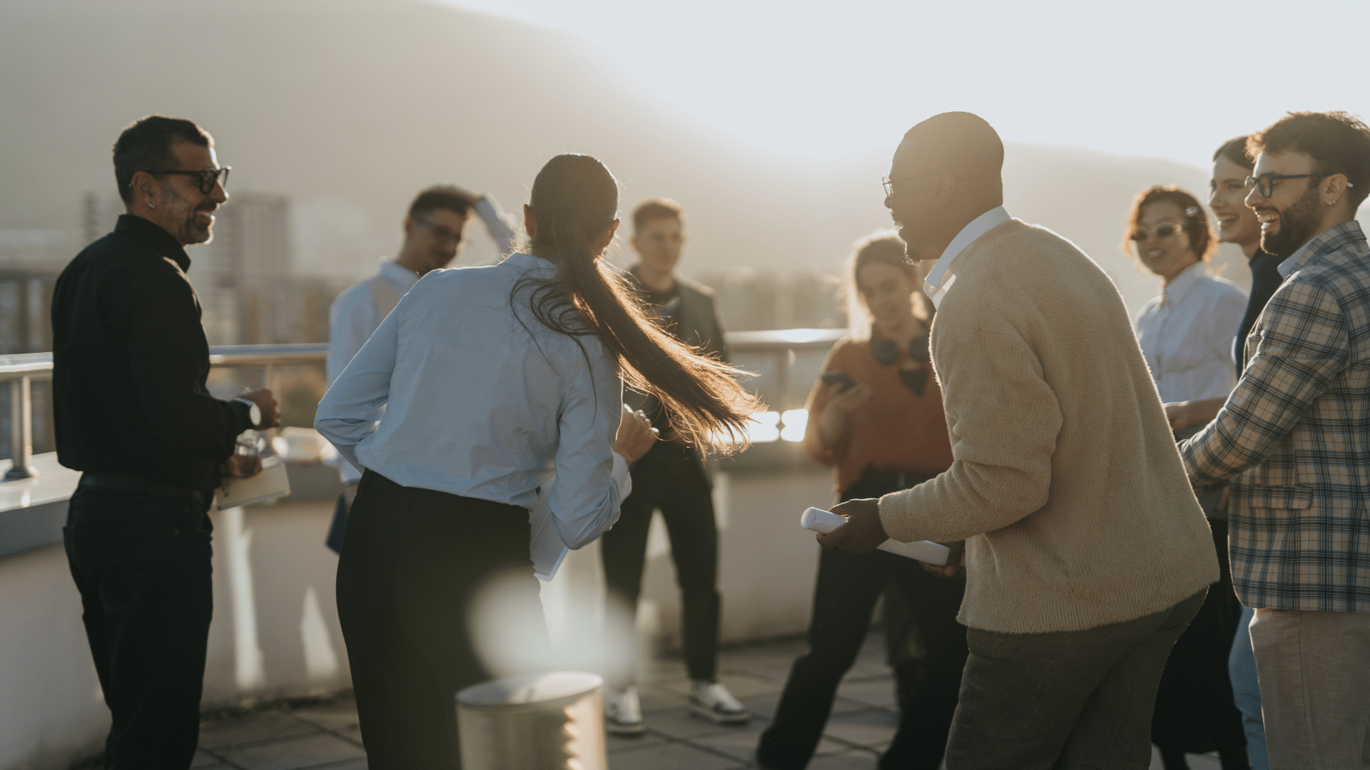 colleagues laughing on balcony