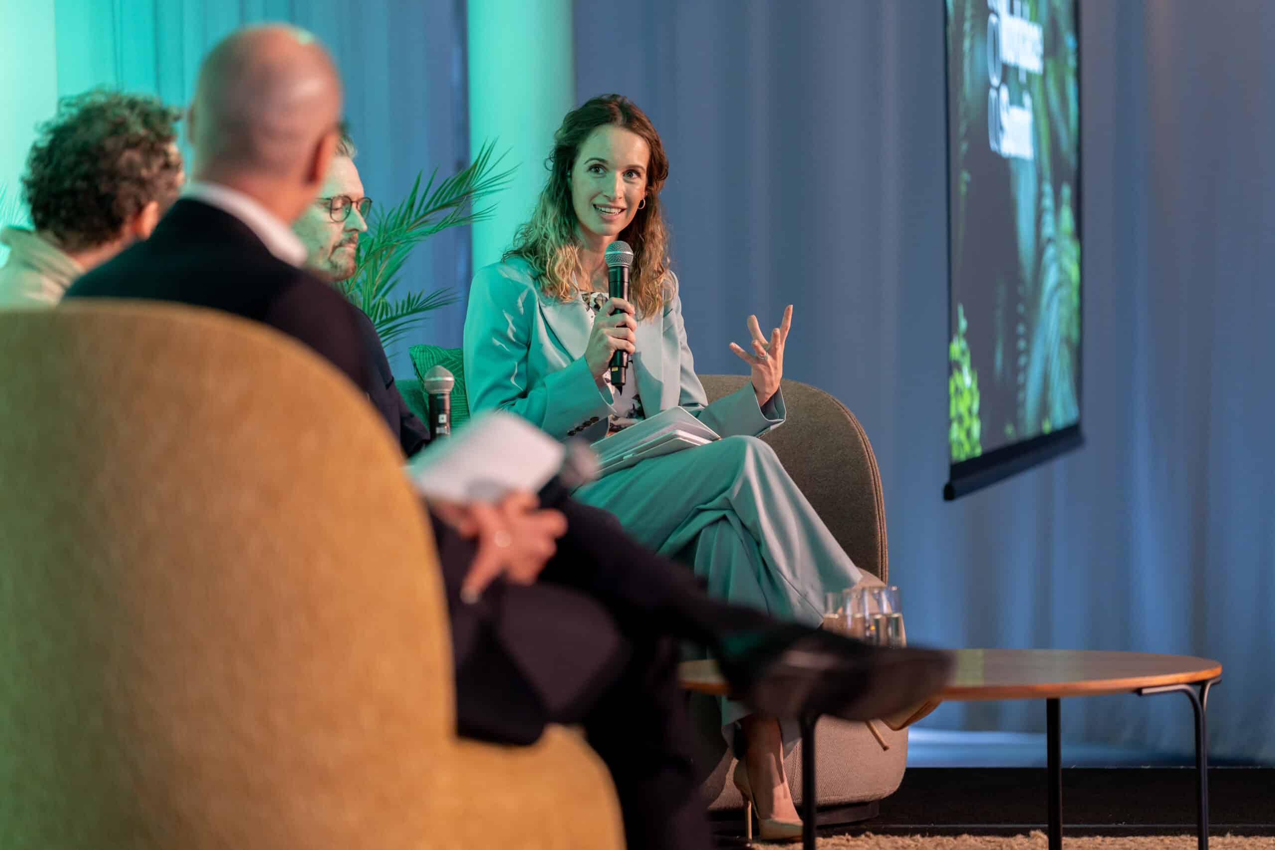 Tica Masuku speaking as a panelist at the 2025 Spaceful Workplace Summit